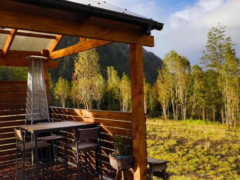 HOM I Cabaña La Ensenada vista parcial al Volcán