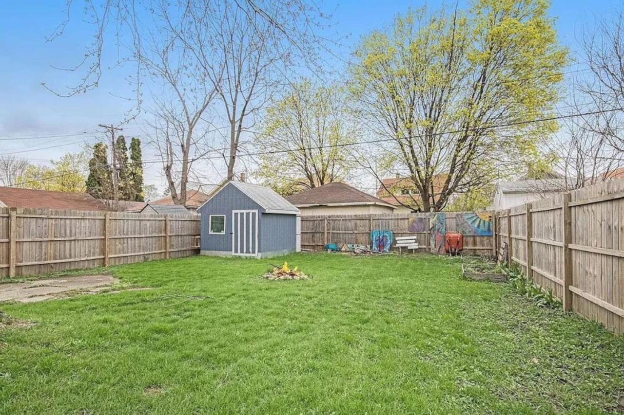 Downtown GR Gem Sleeps 16 Gameroom Huge Backyard view 3