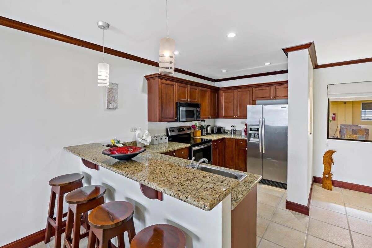 Remodeled Top-Floor Condo with Stunning Wrap-Around Balcony Offering Mountain, Ocean & Marina Views