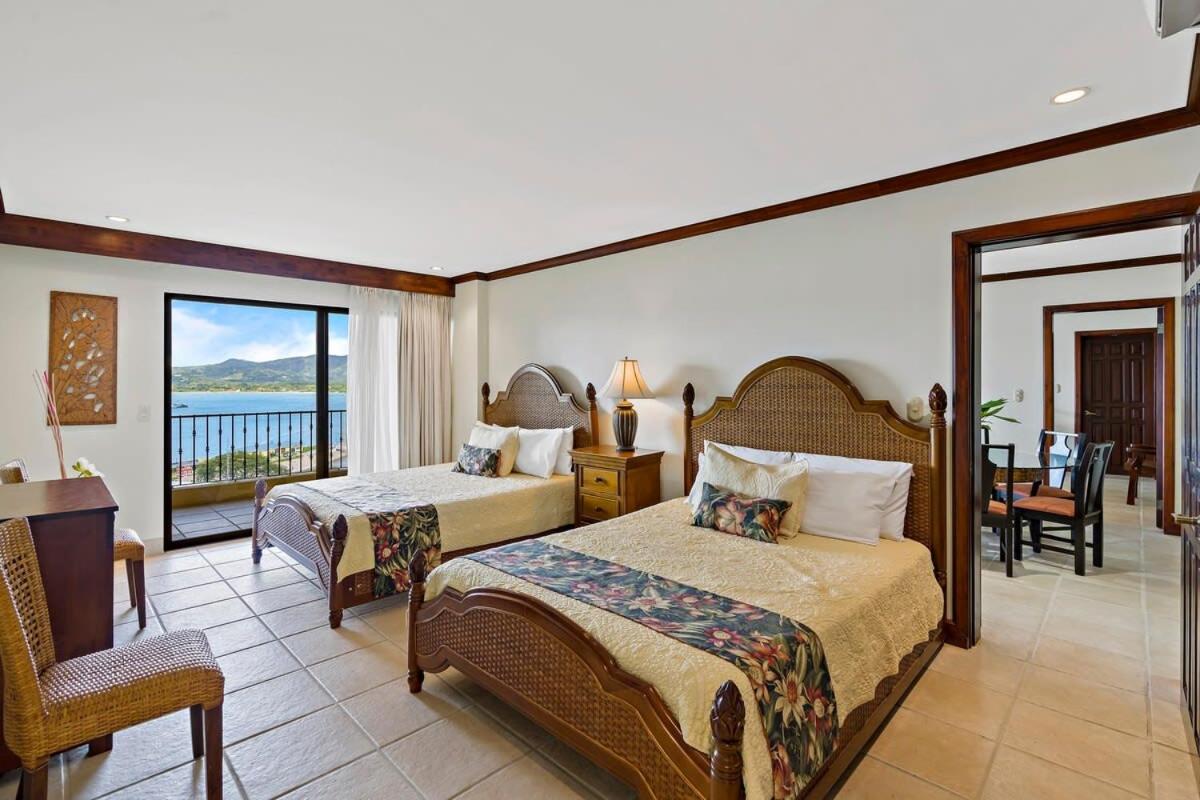 Remodeled Top-Floor Condo with Stunning Wrap-Around Balcony Offering Mountain, Ocean & Marina Views