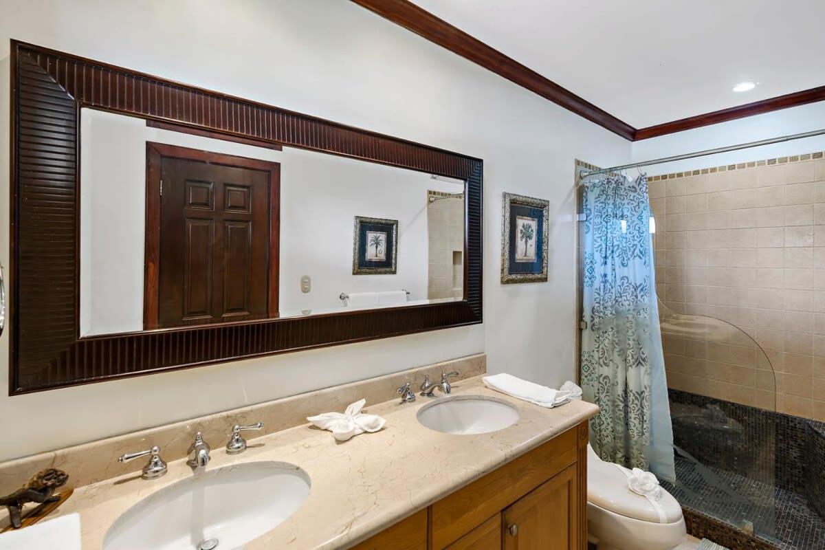 Remodeled Top-Floor Condo with Stunning Wrap-Around Balcony Offering Mountain, Ocean & Marina Views