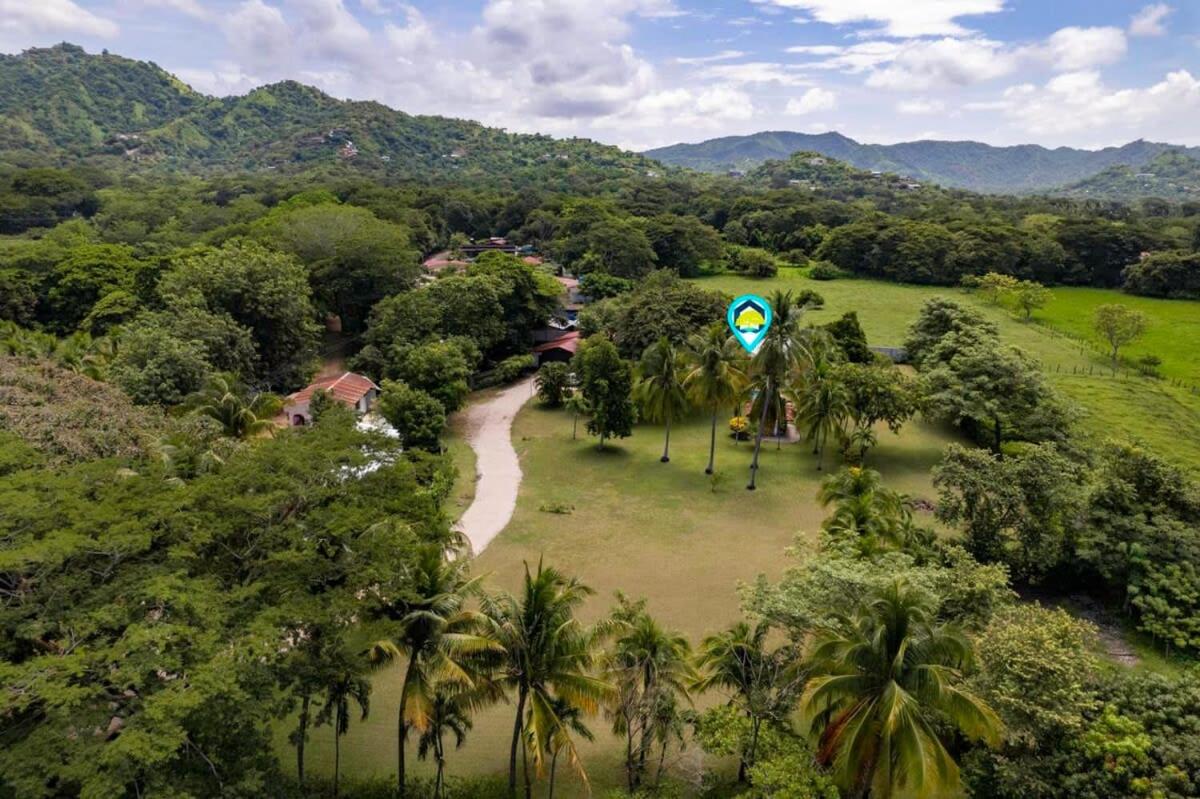Stunning Gated Property with a Lush Garden, Wrap-Around Terrace & Private Pool