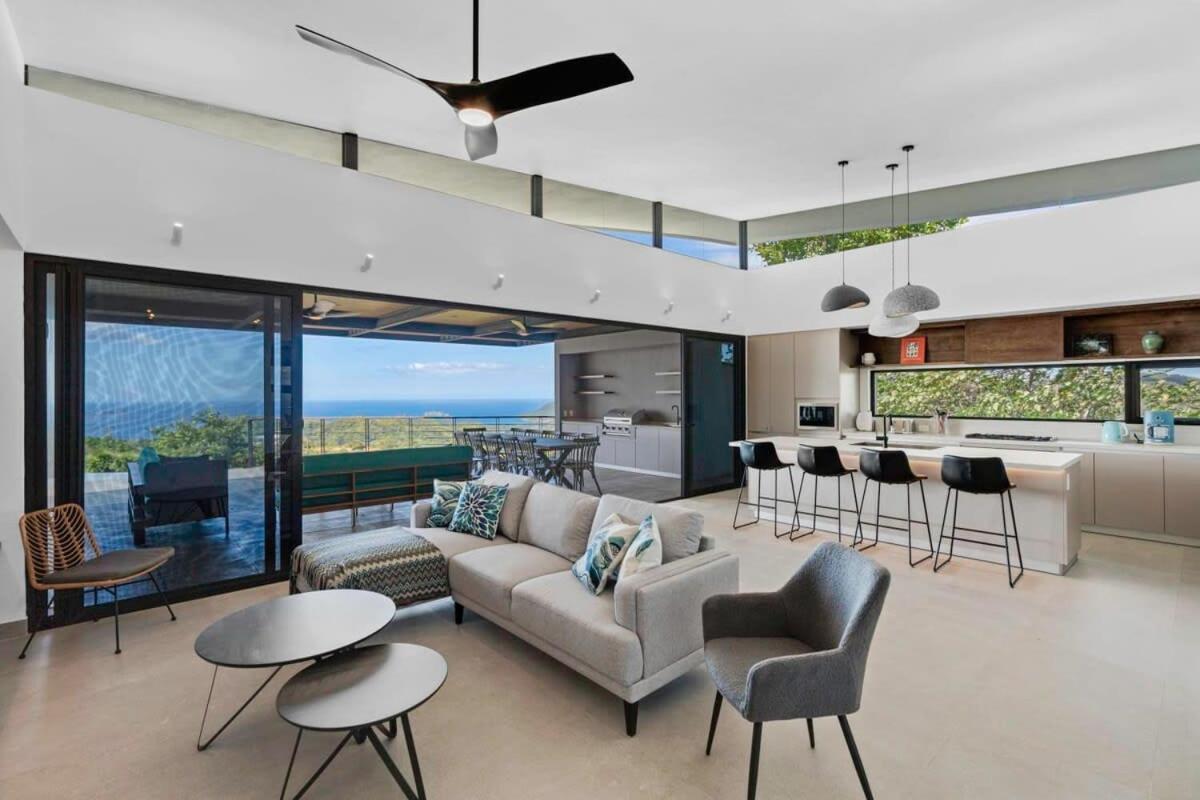 Luxurious Ultramodern Property with Private Suites, Infinity Pool, and Sweeping Ocean and Mountain Views