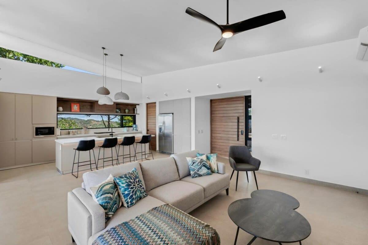 Luxurious Ultramodern Property with Private Suites, Infinity Pool, and Sweeping Ocean and Mountain Views