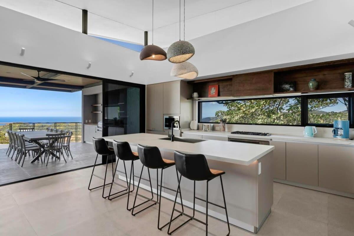 Luxurious Ultramodern Property with Private Suites, Infinity Pool, and Sweeping Ocean and Mountain Views