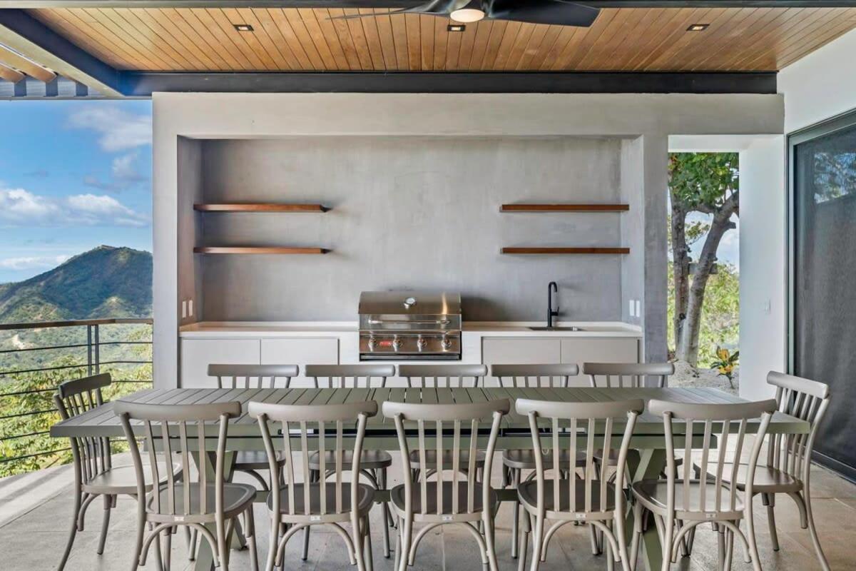 Luxurious Ultramodern Property with Private Suites, Infinity Pool, and Sweeping Ocean and Mountain Views