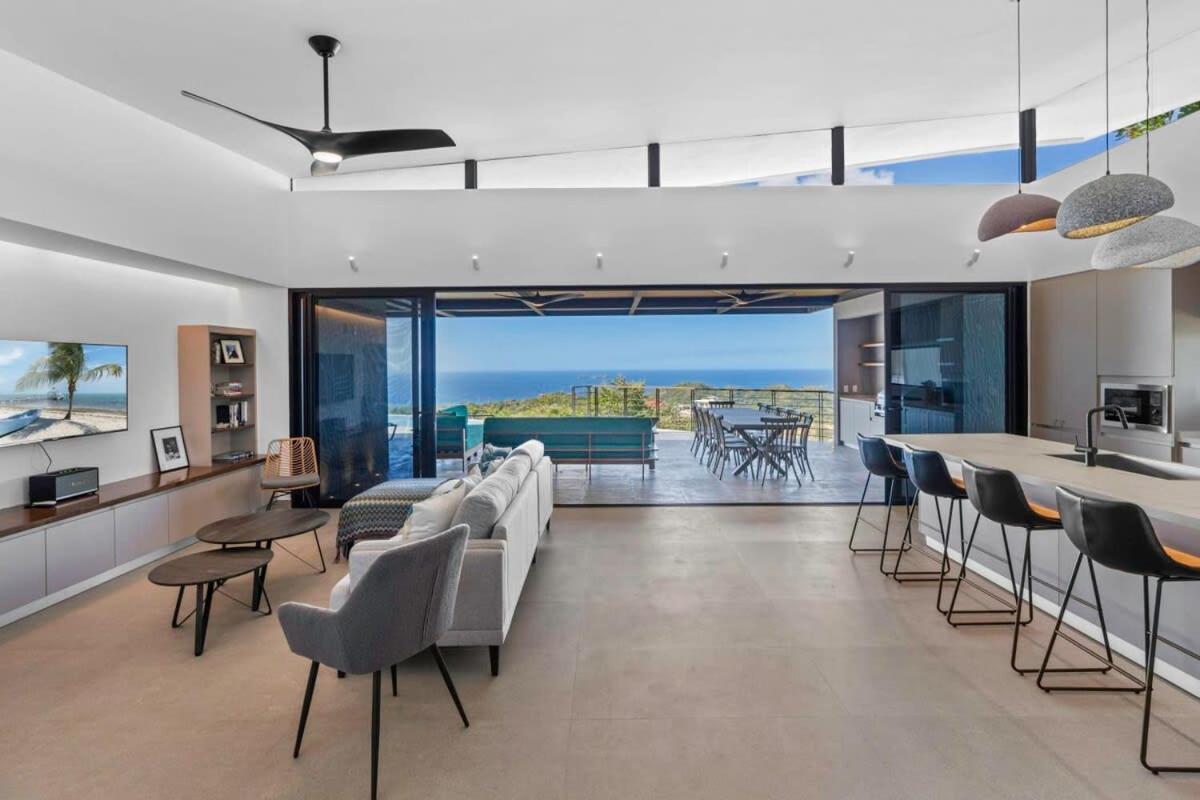 Luxurious Ultramodern Property with Private Suites, Infinity Pool, and Sweeping Ocean and Mountain Views