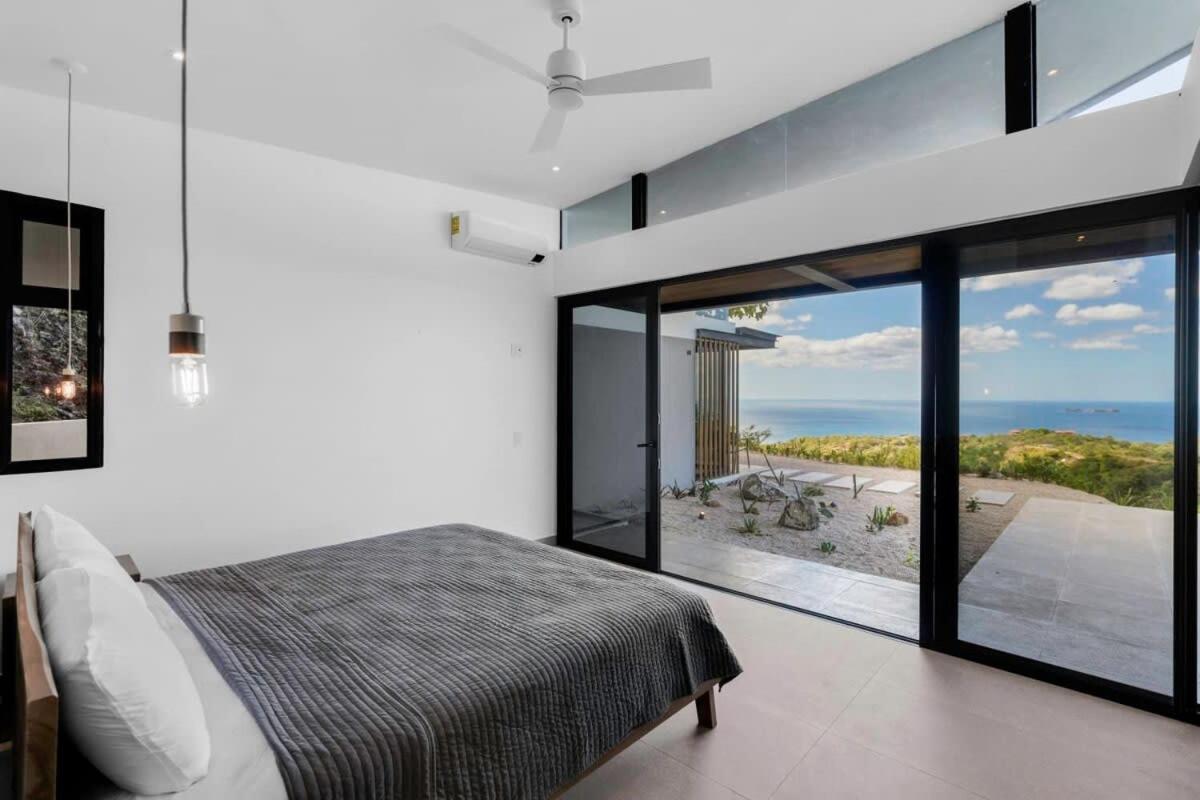 Luxurious Ultramodern Property with Private Suites, Infinity Pool, and Sweeping Ocean and Mountain Views