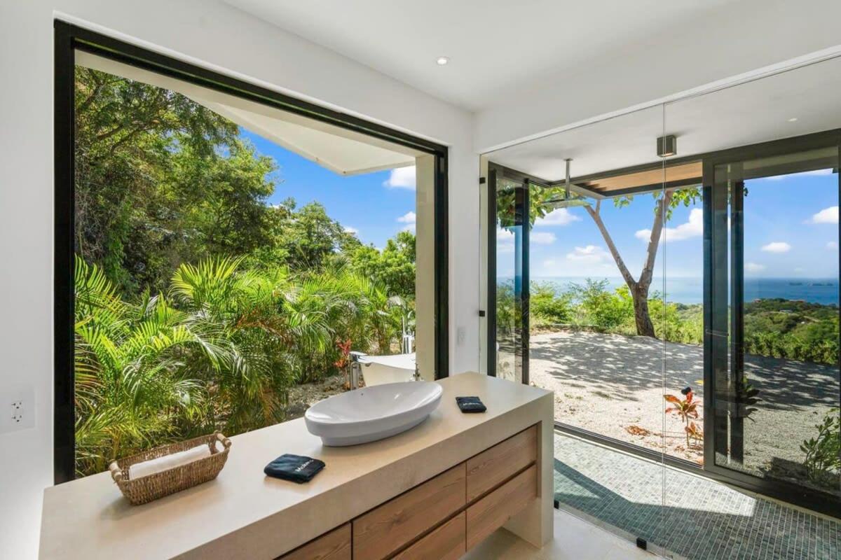 Luxurious Ultramodern Property with Private Suites, Infinity Pool, and Sweeping Ocean and Mountain Views
