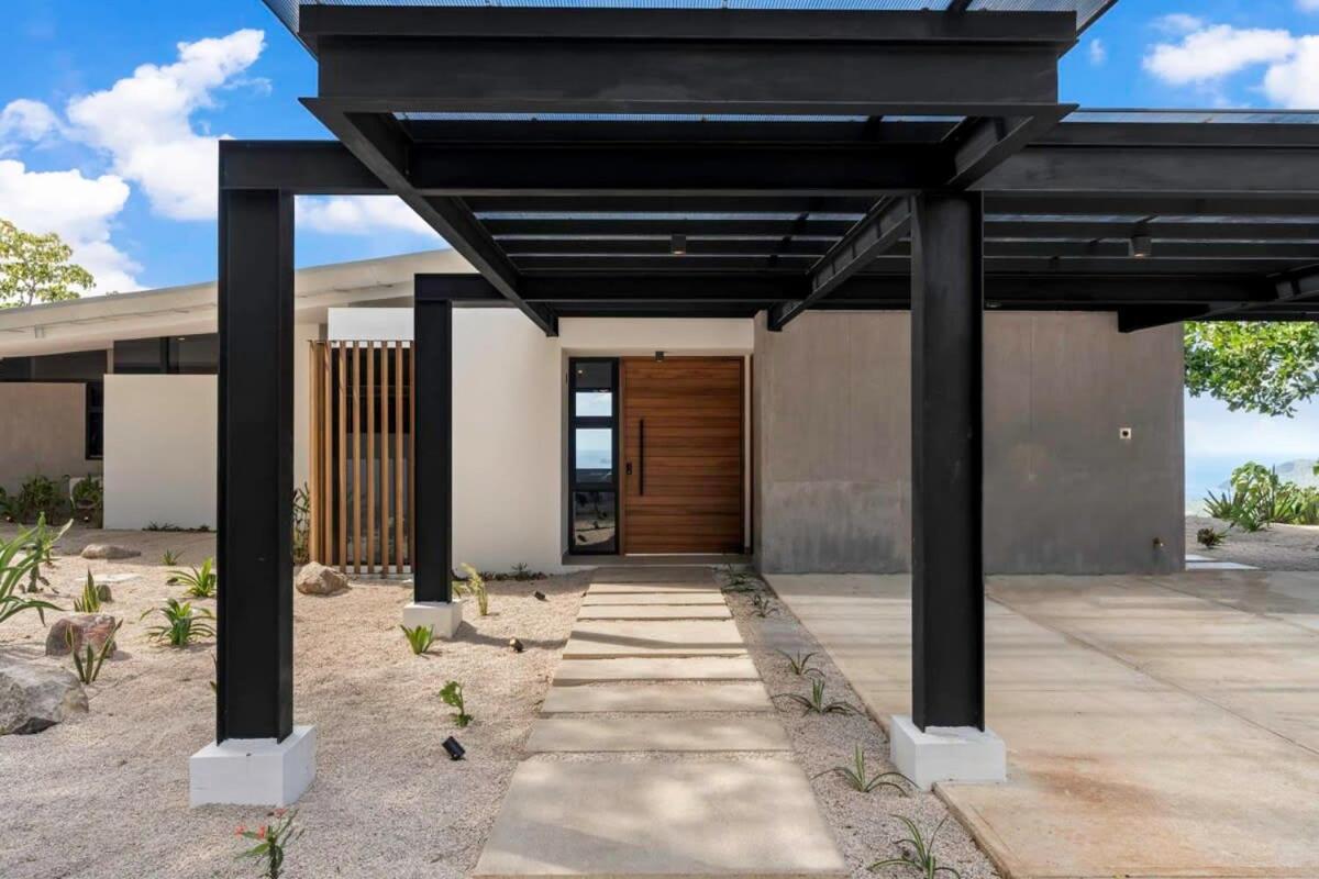 Luxurious Ultramodern Property with Private Suites, Infinity Pool, and Sweeping Ocean and Mountain Views