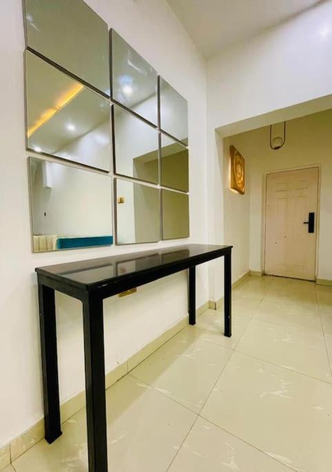 Central Oasis - Entire 3 Bedroom Apartment in Abuja with Pool, Games, WiFi, Balcony, and Garden view 3