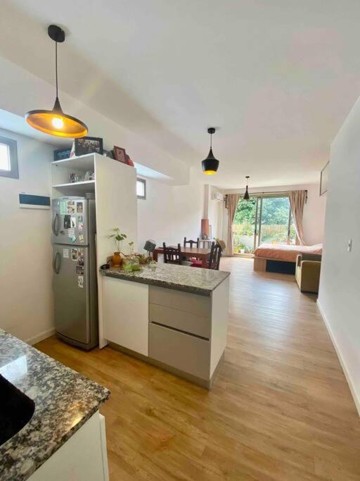 Apartment with balcony, garden and parrilla
