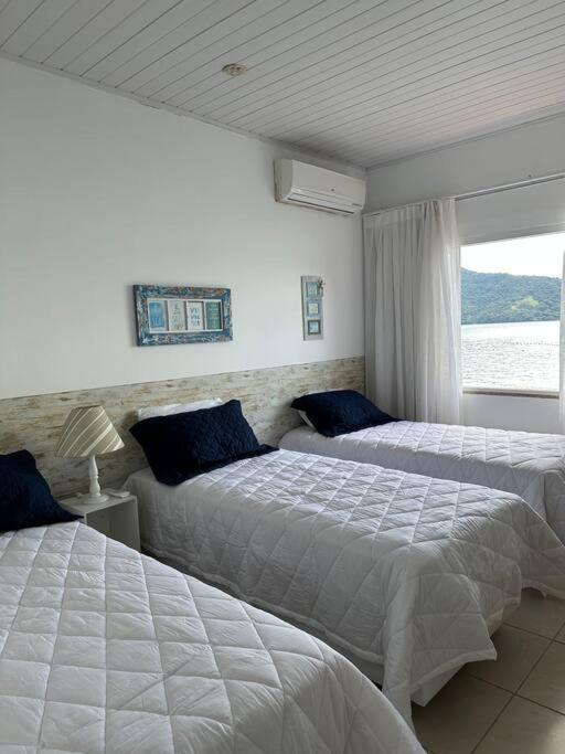 Casa de veraneio com deck em Passa Terra, Ilha Grande