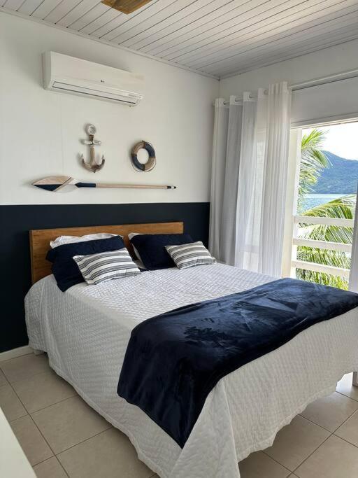 Casa de veraneio com deck em Passa Terra, Ilha Grande