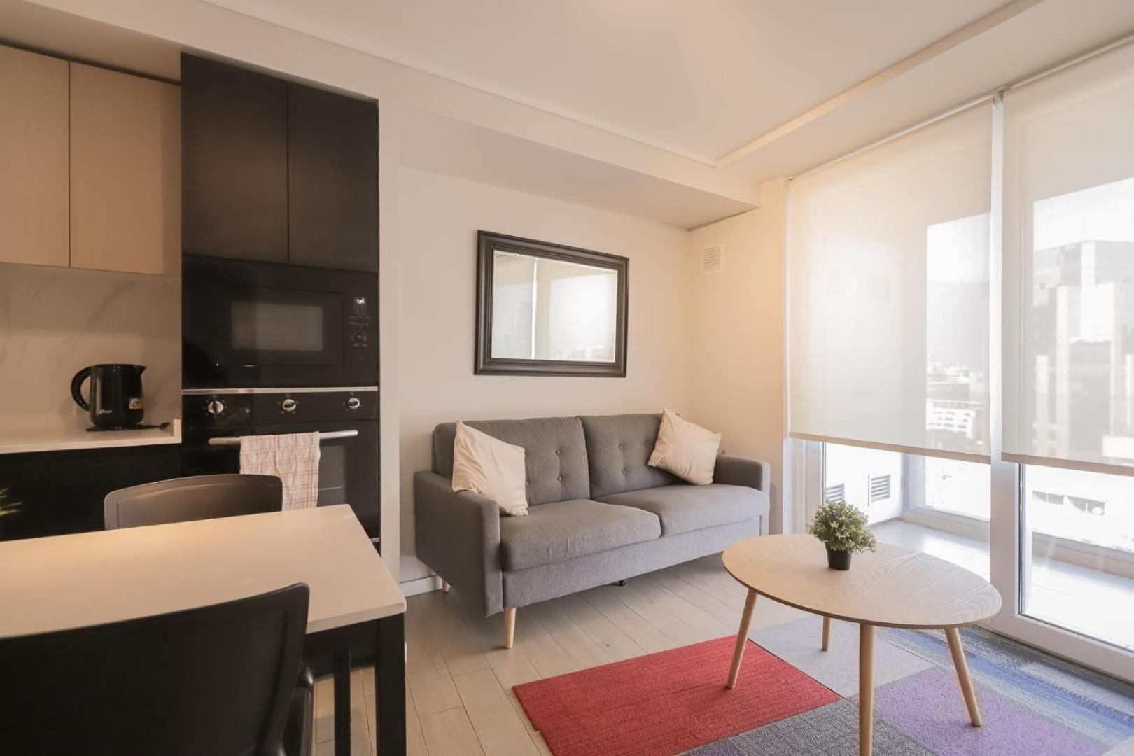 Cozy apartment steps away from Costanera Center