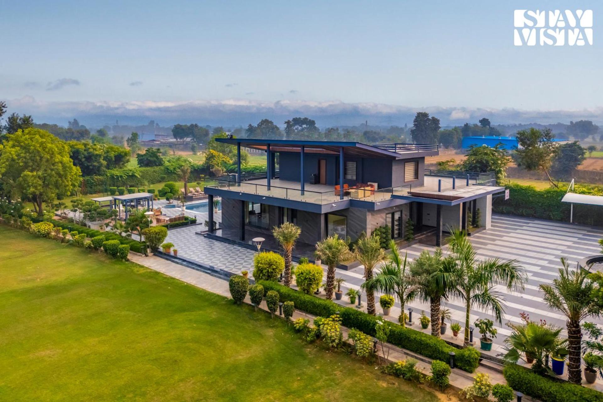 StayVista's Hampton Acres - Outdoor Pool, Vast Lawn & Terrace view 2