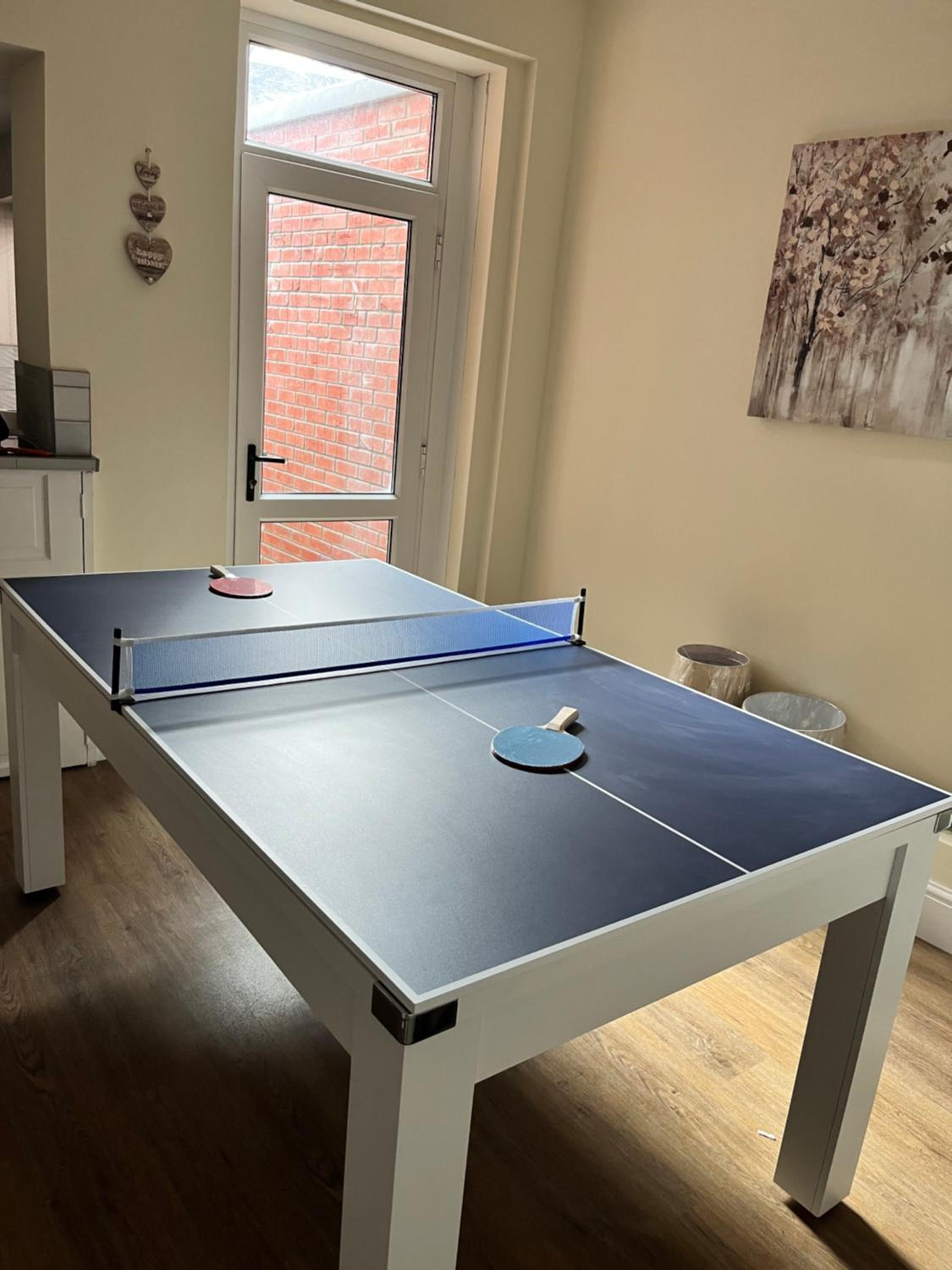 4 bedroom, sleeps 8, 30 seconds from beach, games table view 3