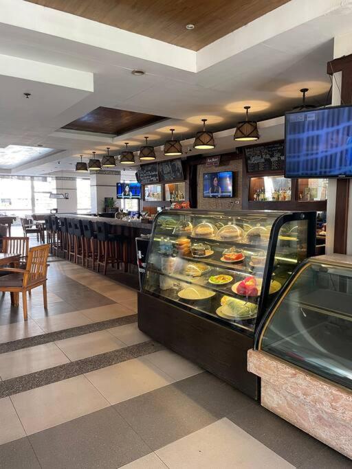 2BR fully airconditioned condo with balcony & free parking at Tivoli view 3