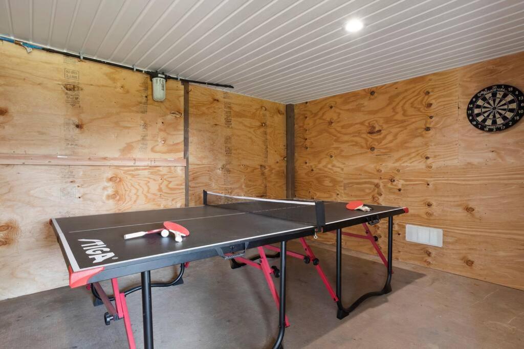 Waterfront Home Game Room Ping Pong Outdoor Bar Area