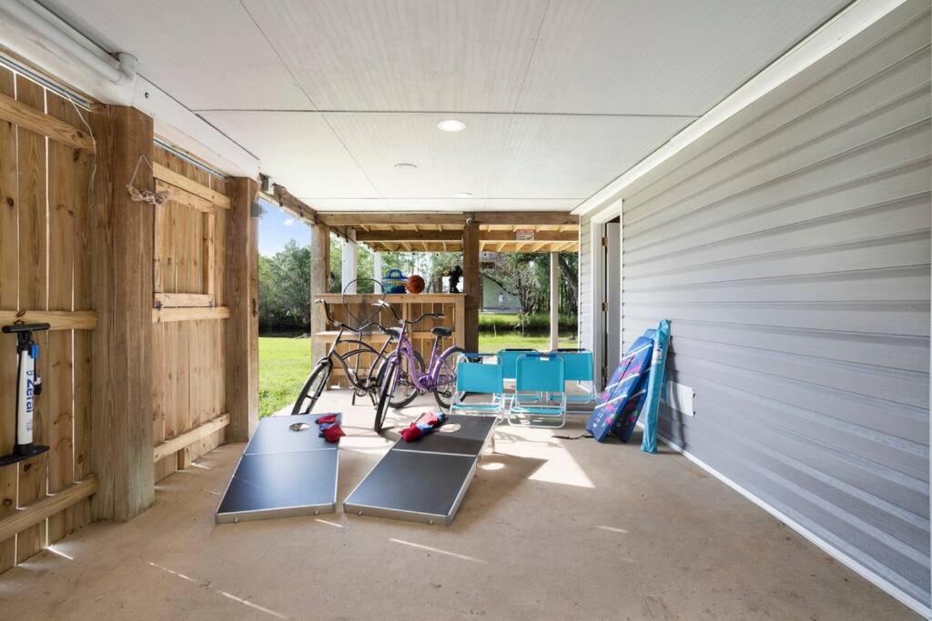 Waterfront Home Game Room Ping Pong Outdoor Bar Area