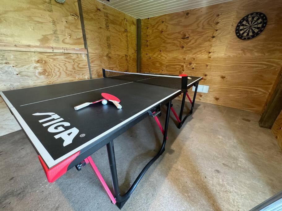 Waterfront Home Game Room Ping Pong Outdoor Bar Area