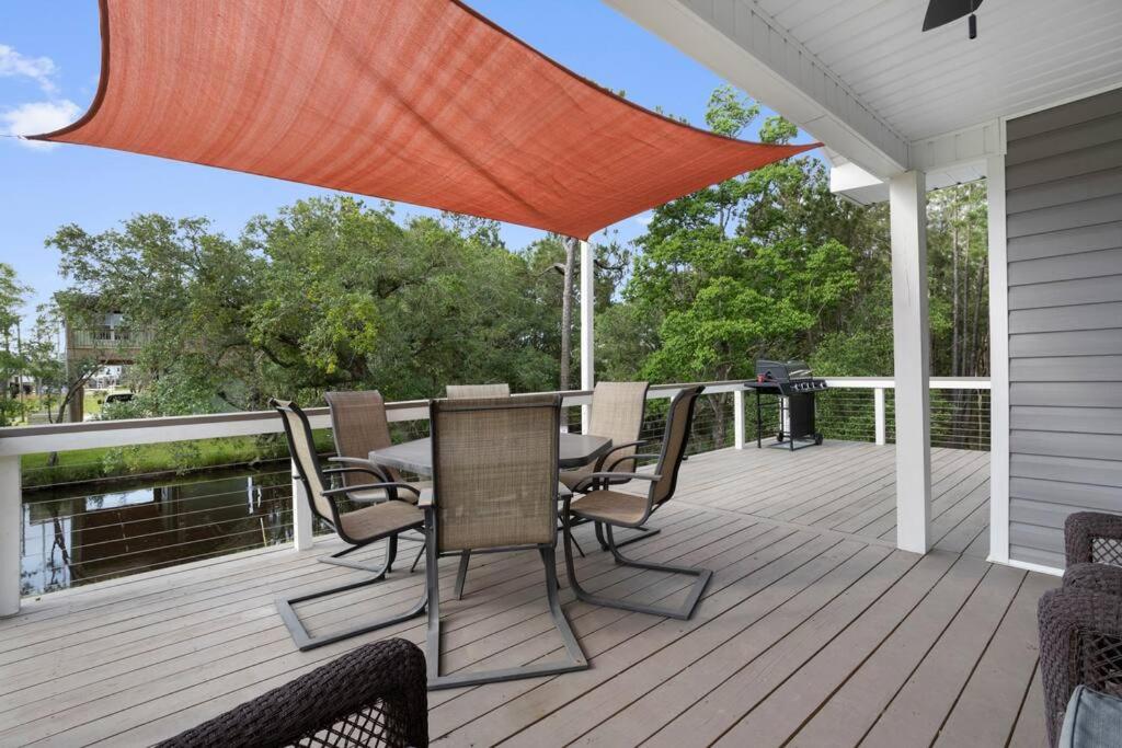 Waterfront Home Game Room Ping Pong Outdoor Bar Area