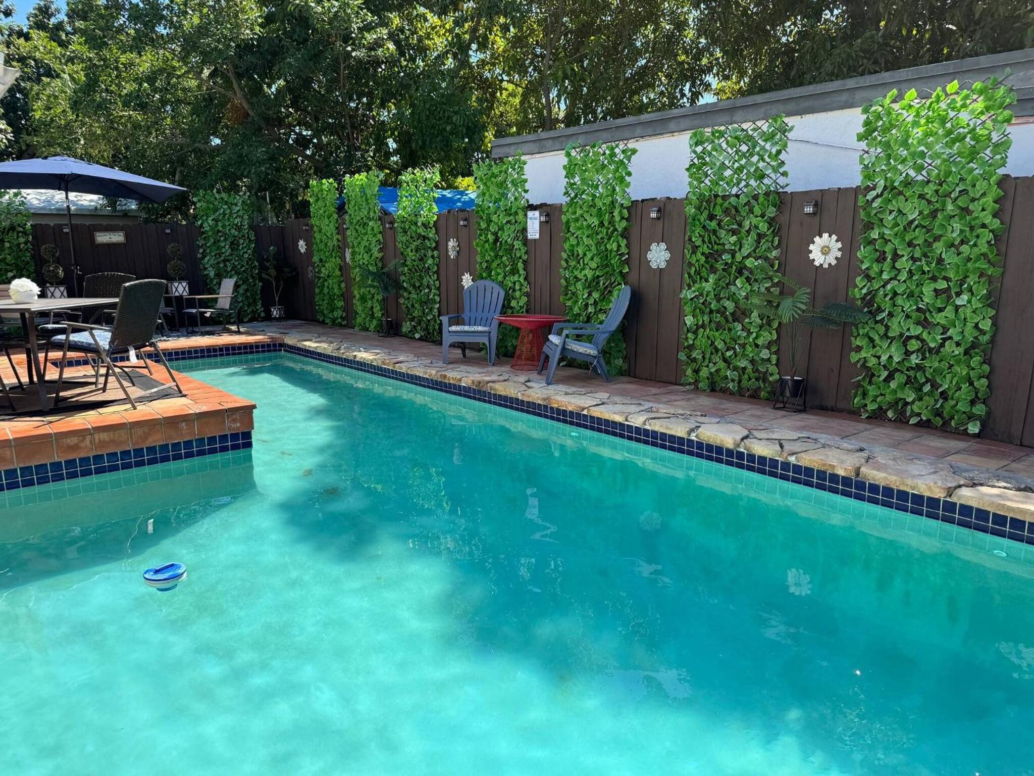 Stay Central: Relax in Our Heated Pool Oasis