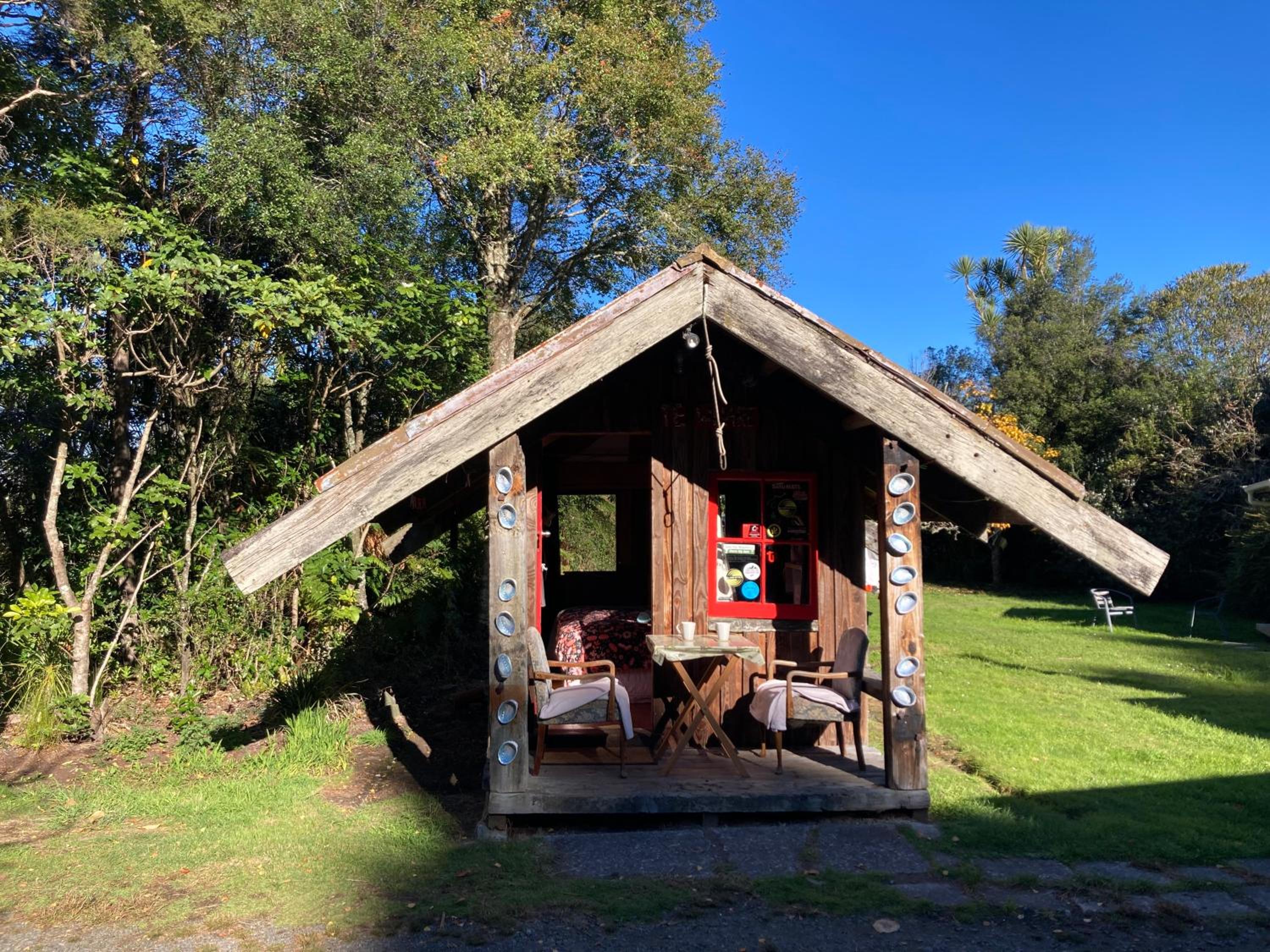 Whare&geothermal pool by lake Taupo