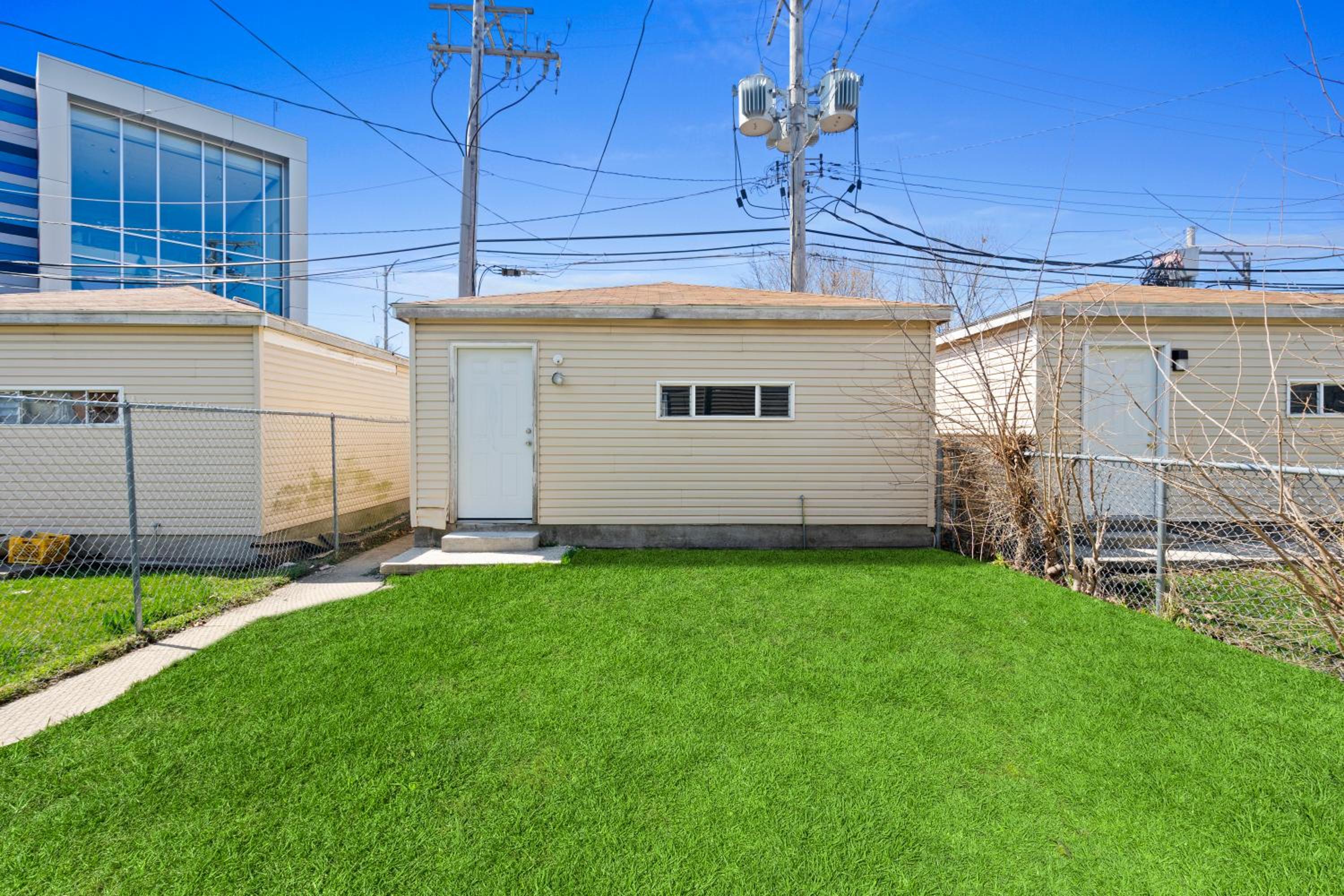 Newly rehabbed Greystone with 2 private apartments, backyard, garage, laundry, close to expressway view 3