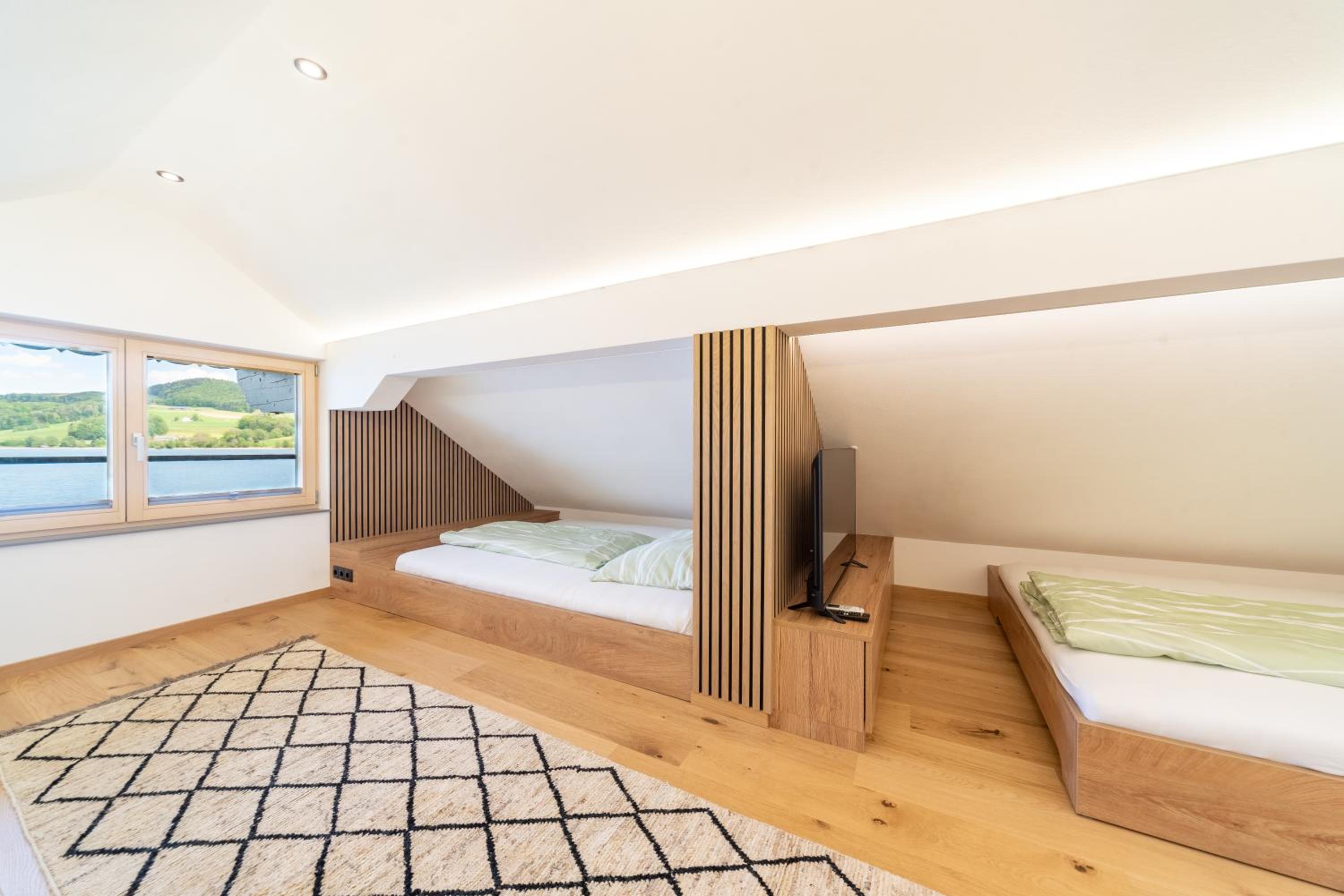 Exklusives Seehaus LAKEHOUSE in Bestlage mit privaten Sandstrand und eigenem Boot und SUP