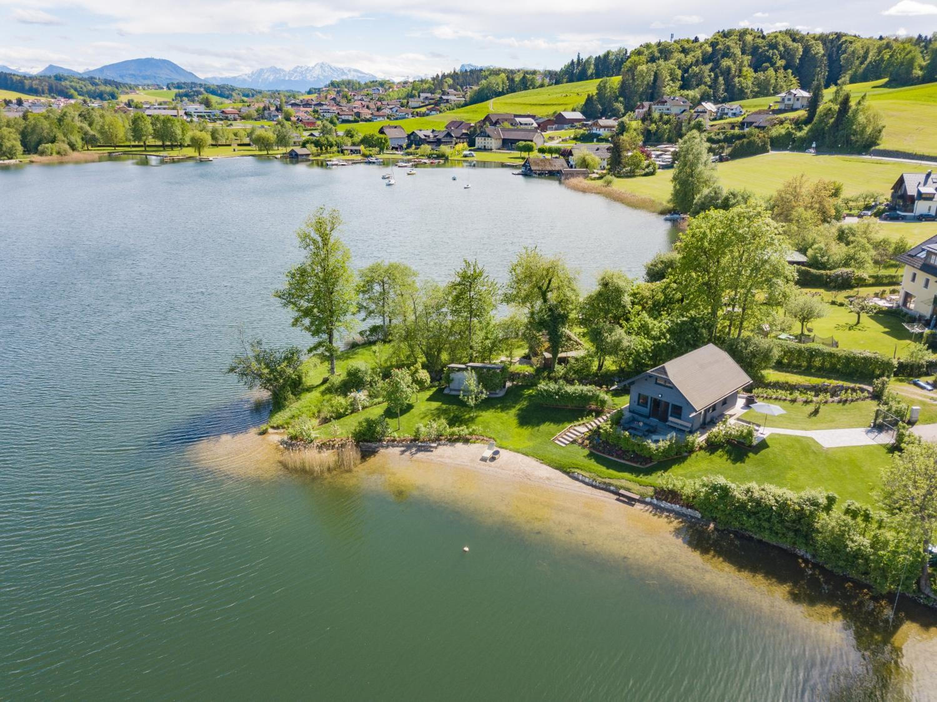 Exklusives Seehaus LAKEHOUSE in Bestlage mit privaten Sandstrand und eigenem Boot und SUP