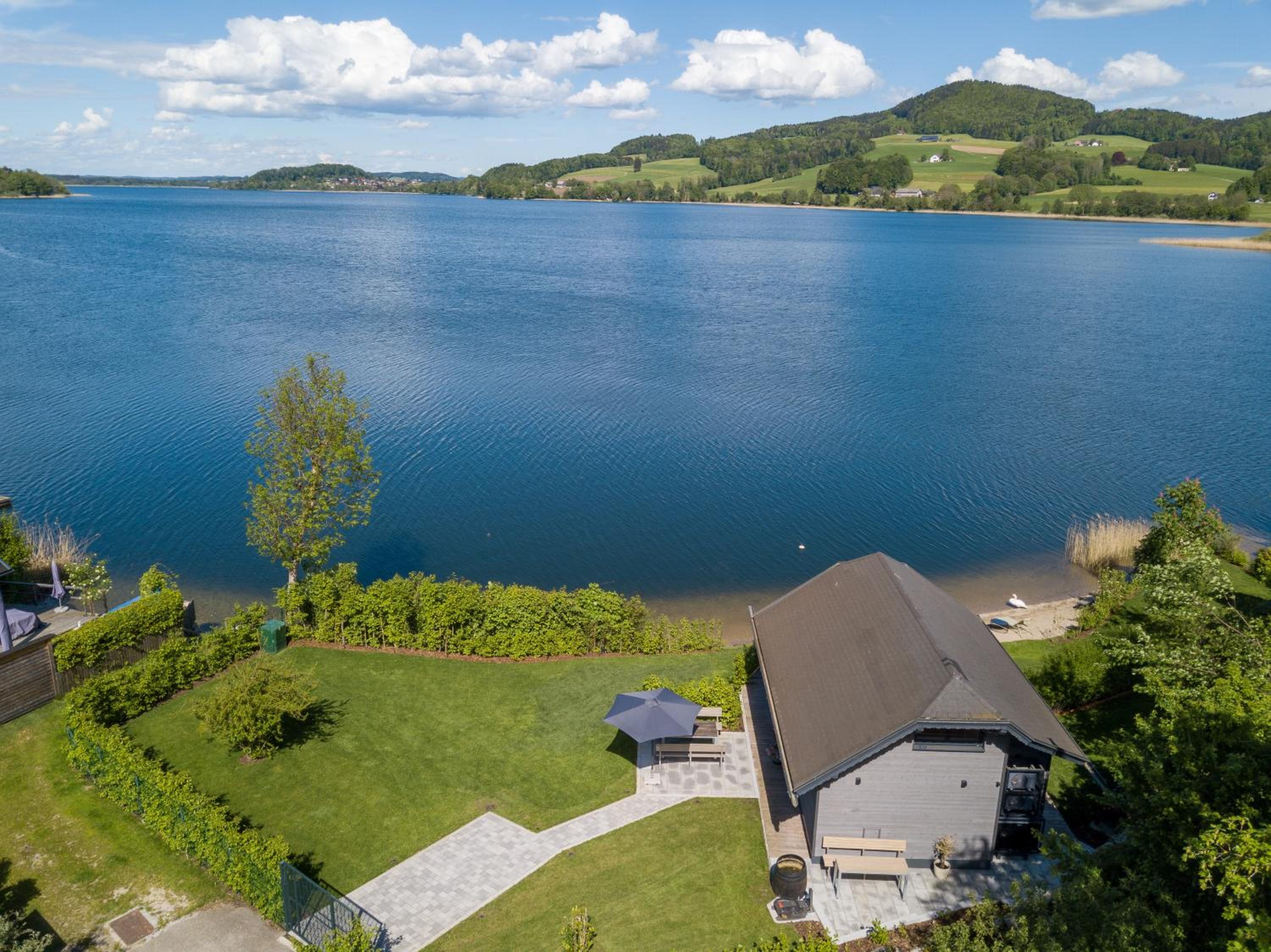 Exklusives Seehaus LAKEHOUSE in Bestlage mit privaten Sandstrand und eigenem Boot und SUP