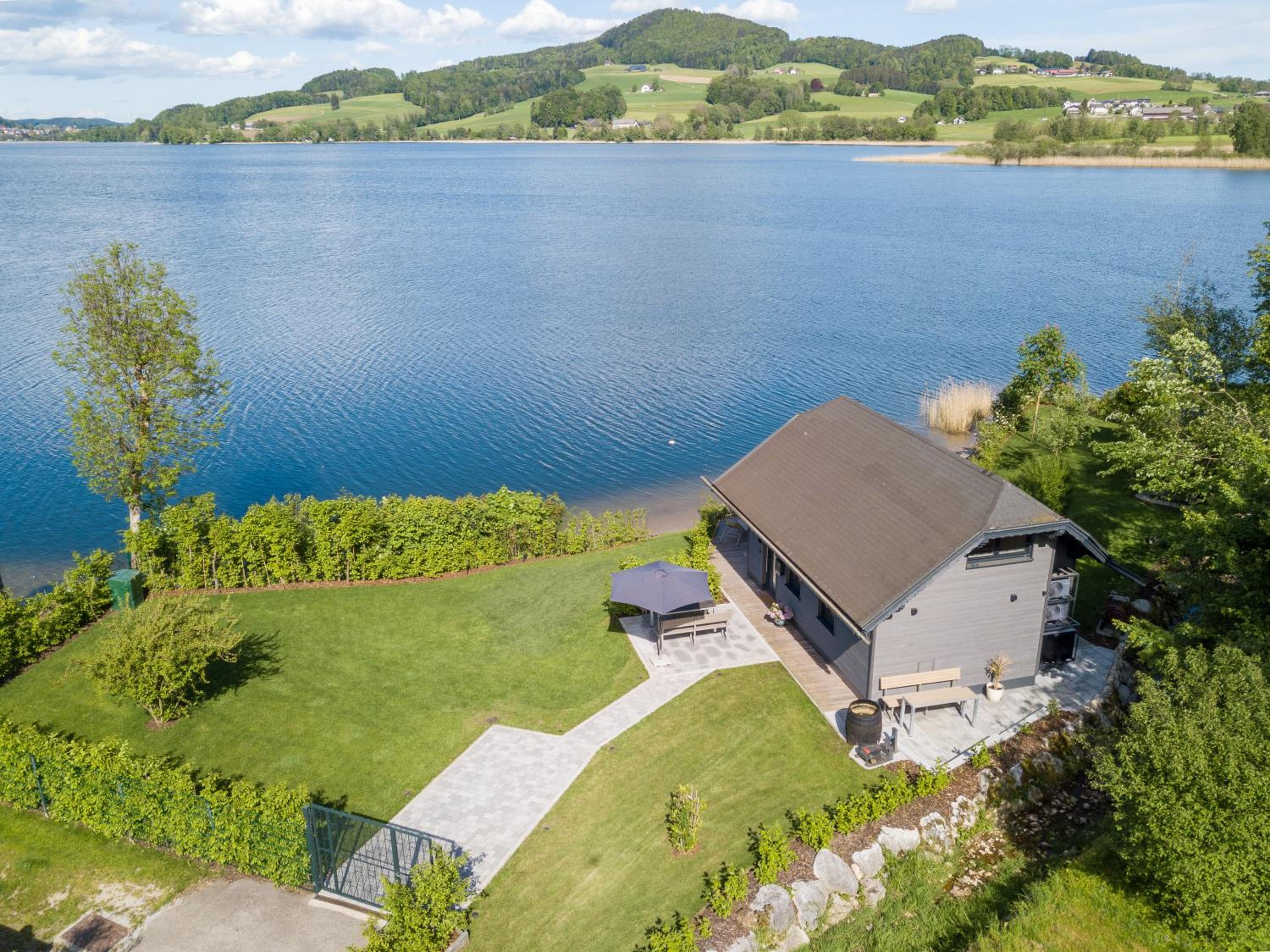 Exklusives Seehaus LAKEHOUSE in Bestlage mit privaten Sandstrand und eigenem Boot und SUP