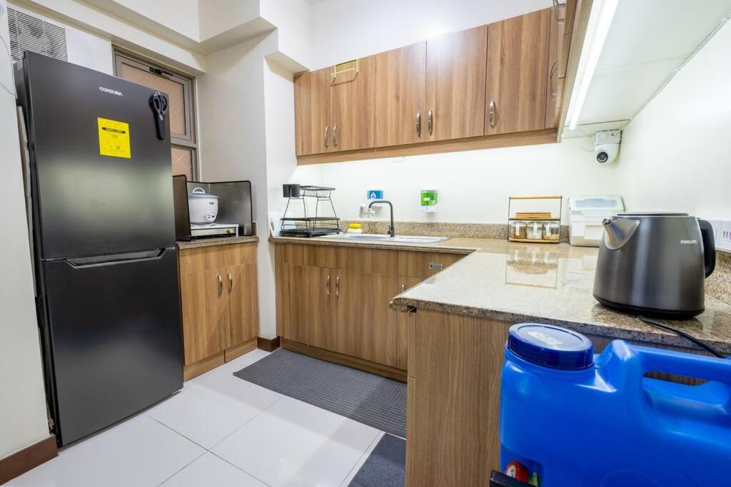 2BR Fully Air-Conditioned Staycation with Parking