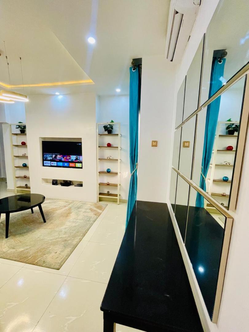 Central Oasis - Entire 3 Bedroom Apartment in Abuja with Pool, Games, WiFi, Balcony, and Garden view 2