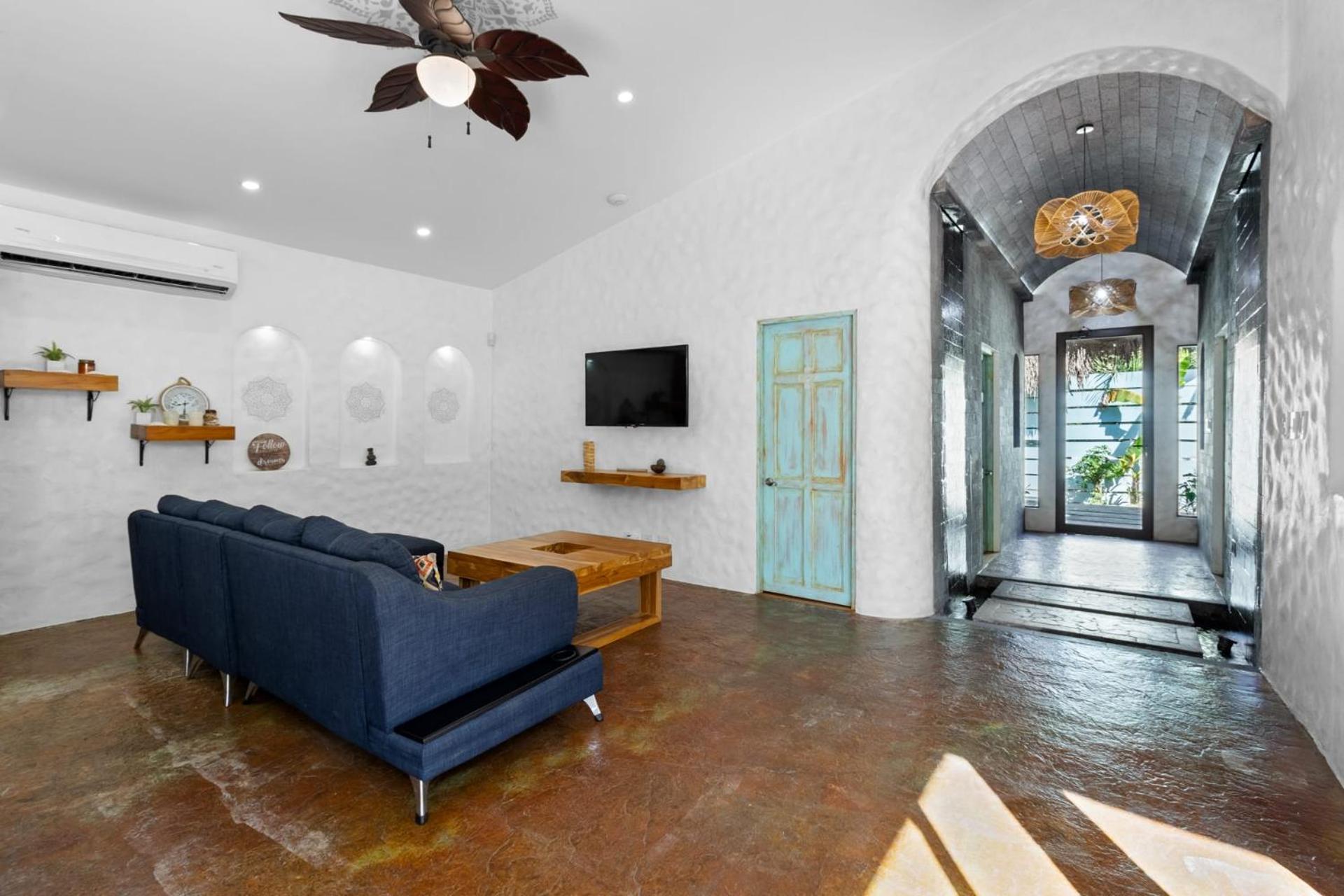Modern Home with Chic Bohemian Style and Zen Outdoor Oasis with Swimming Pool and Tiki Style Dining Space