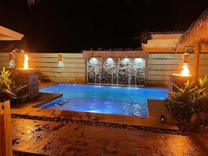 Modern Home with Chic Bohemian Style and Zen Outdoor Oasis with Swimming Pool and Tiki Style Dining Space