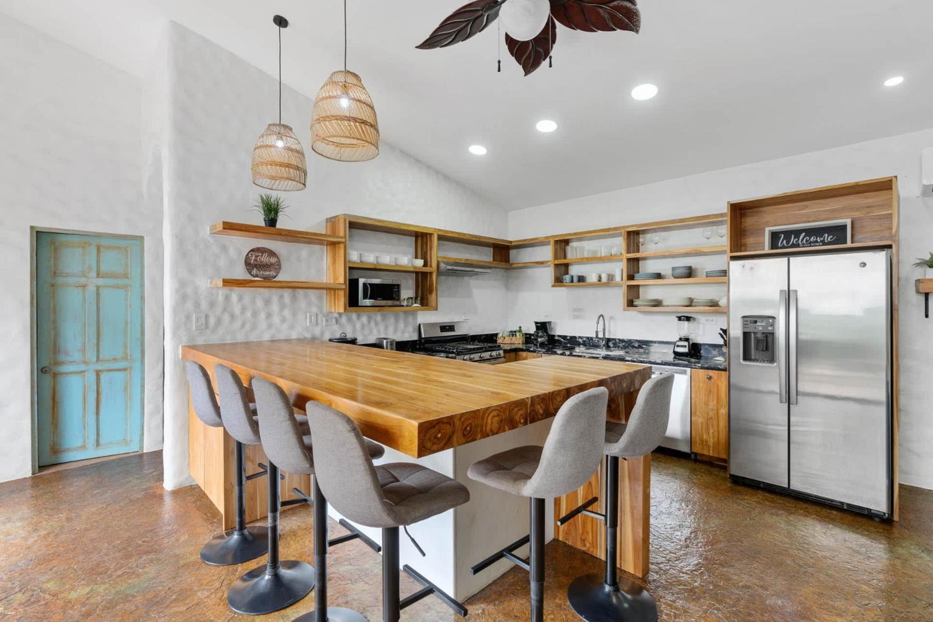 Modern Home with Chic Bohemian Style and Zen Outdoor Oasis with Swimming Pool and Tiki Style Dining Space