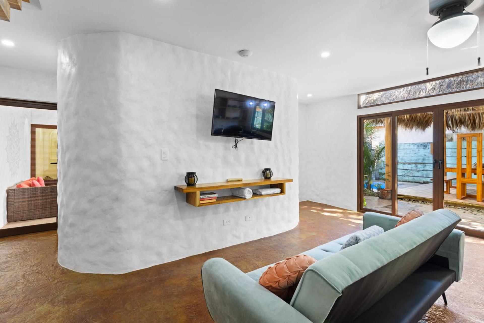 Modern Home with Chic Bohemian Style and Zen Outdoor Oasis with Swimming Pool and Tiki Style Dining Space