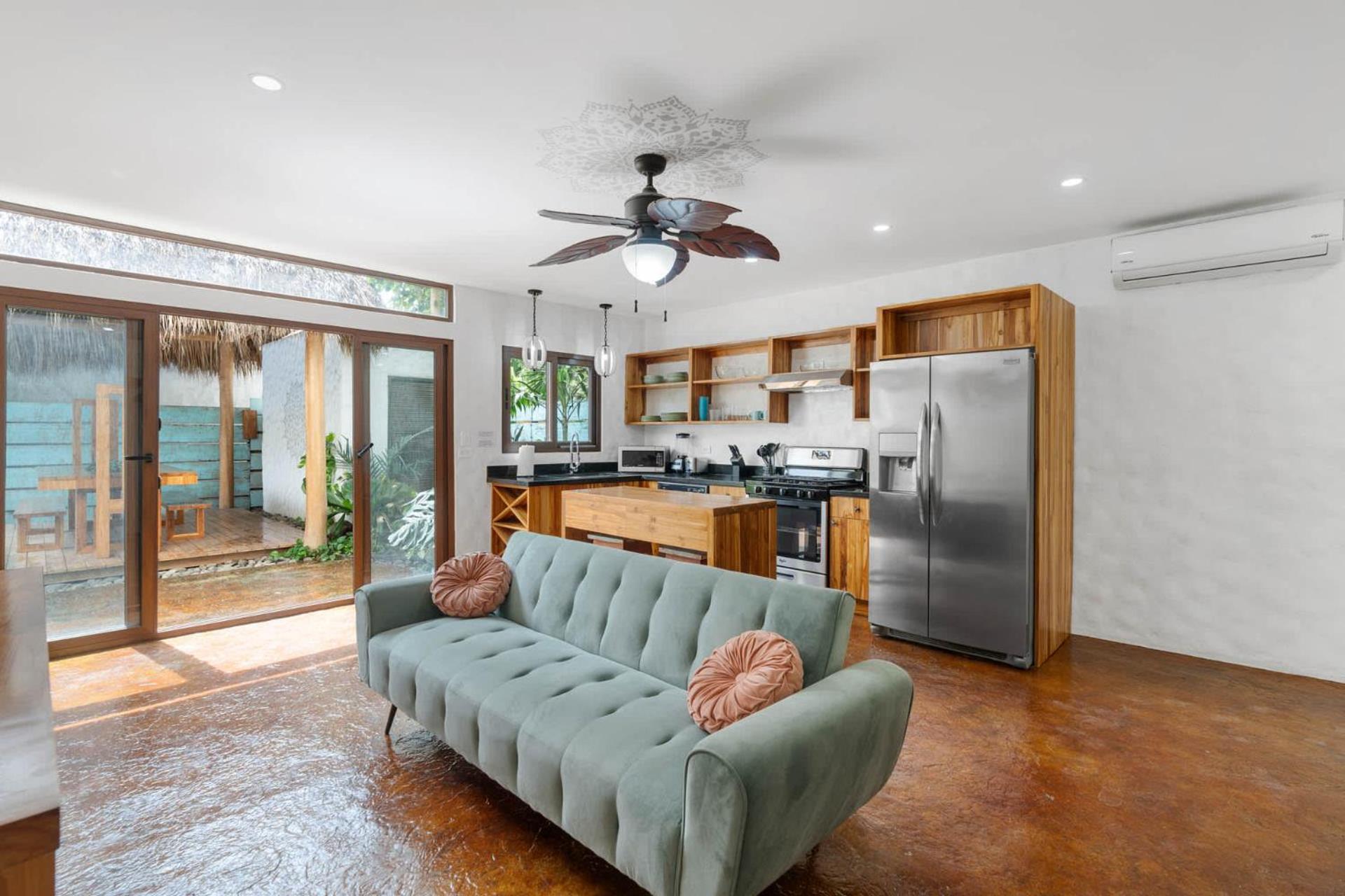 Modern Home with Chic Bohemian Style and Zen Outdoor Oasis with Swimming Pool and Tiki Style Dining Space