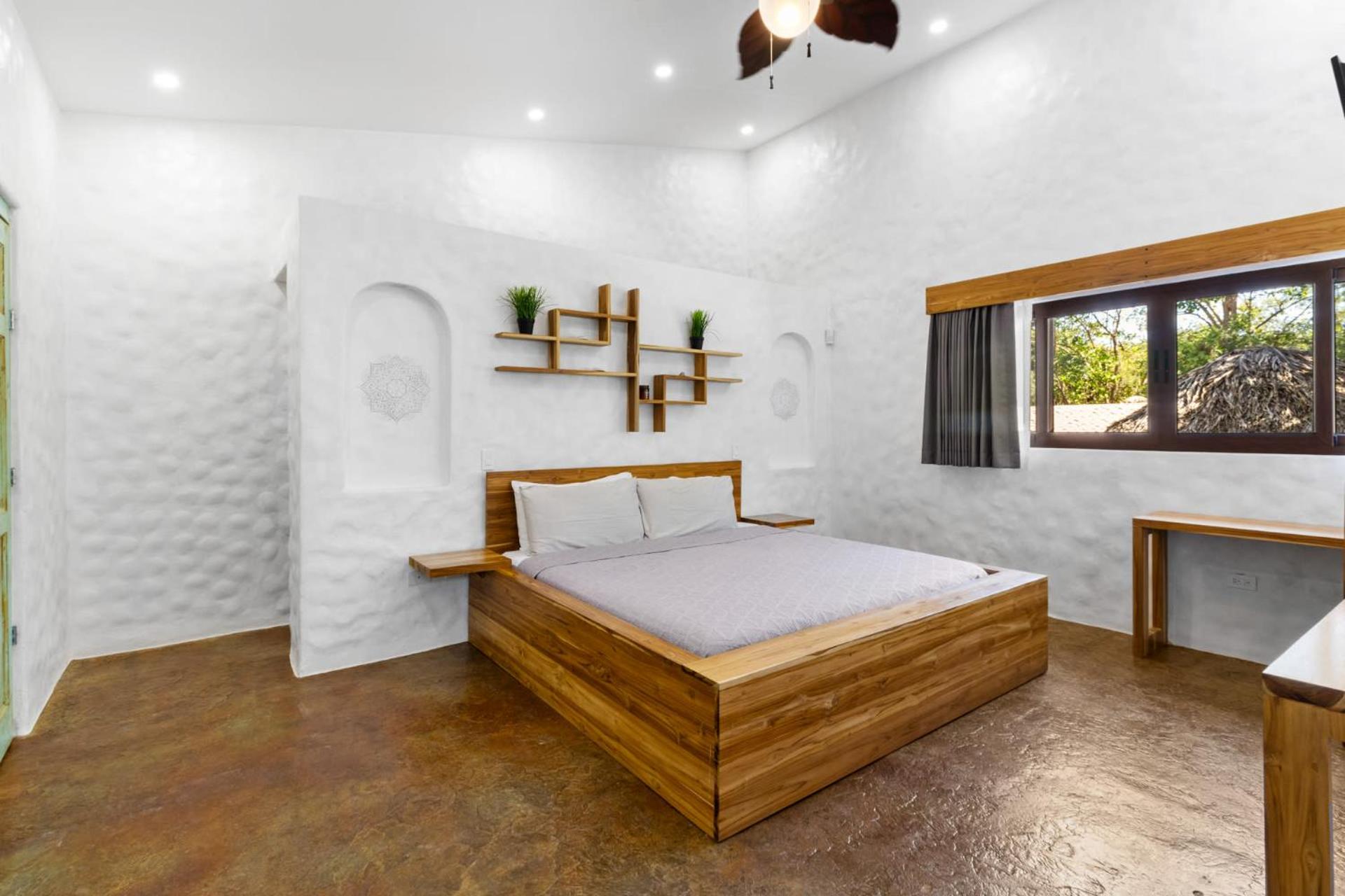 Modern Home with Chic Bohemian Style and Zen Outdoor Oasis with Swimming Pool and Tiki Style Dining Space