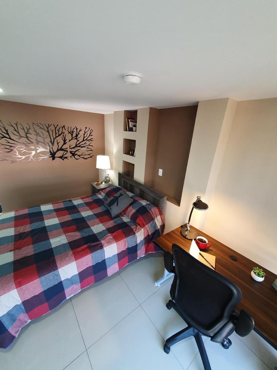 S09 SUITE KING Premium Suite TEC CEM Cocineta WiFi Balcón Parking Terraza view 3
