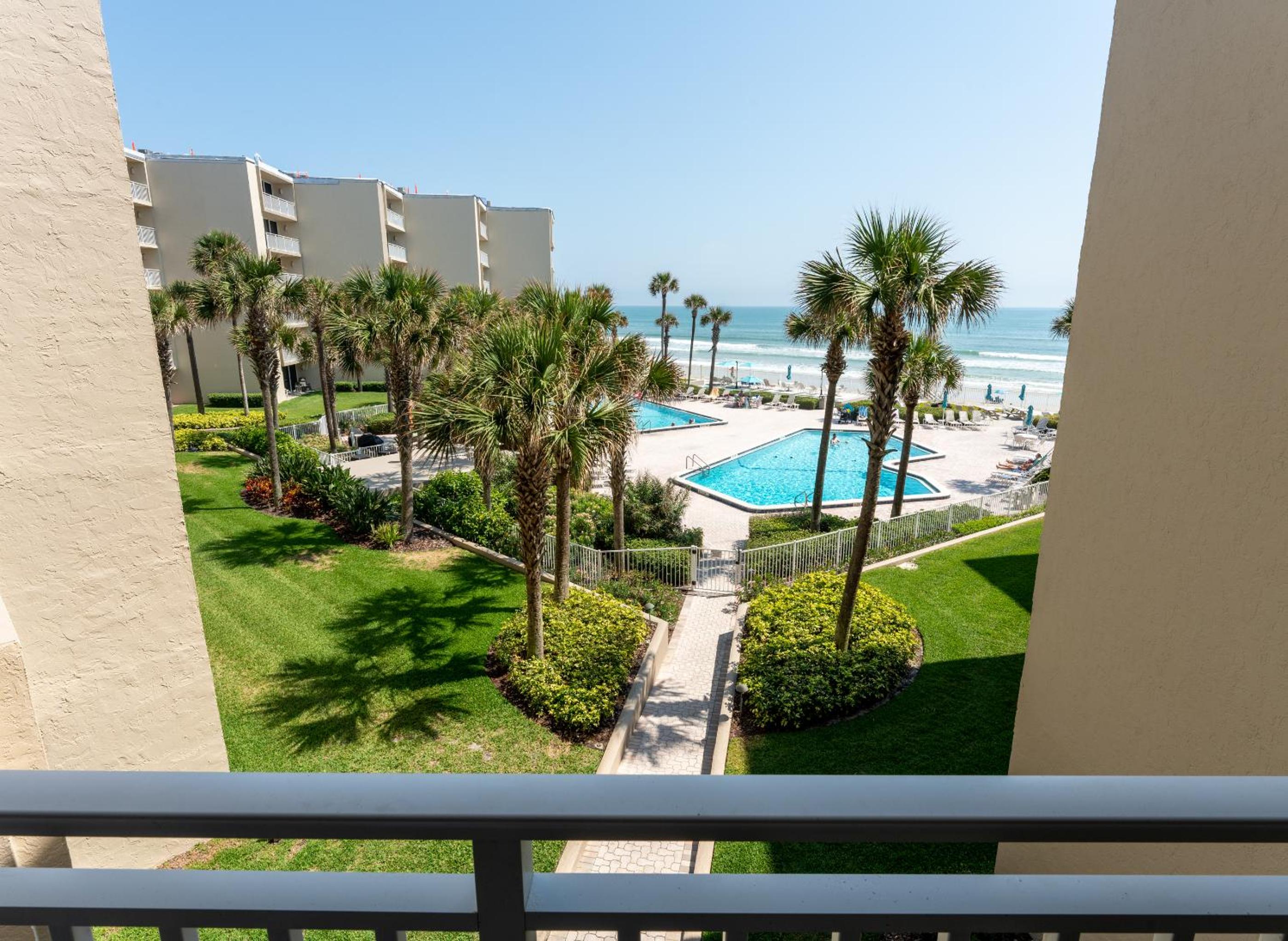 Coastal condo with beachfront views and pool access!