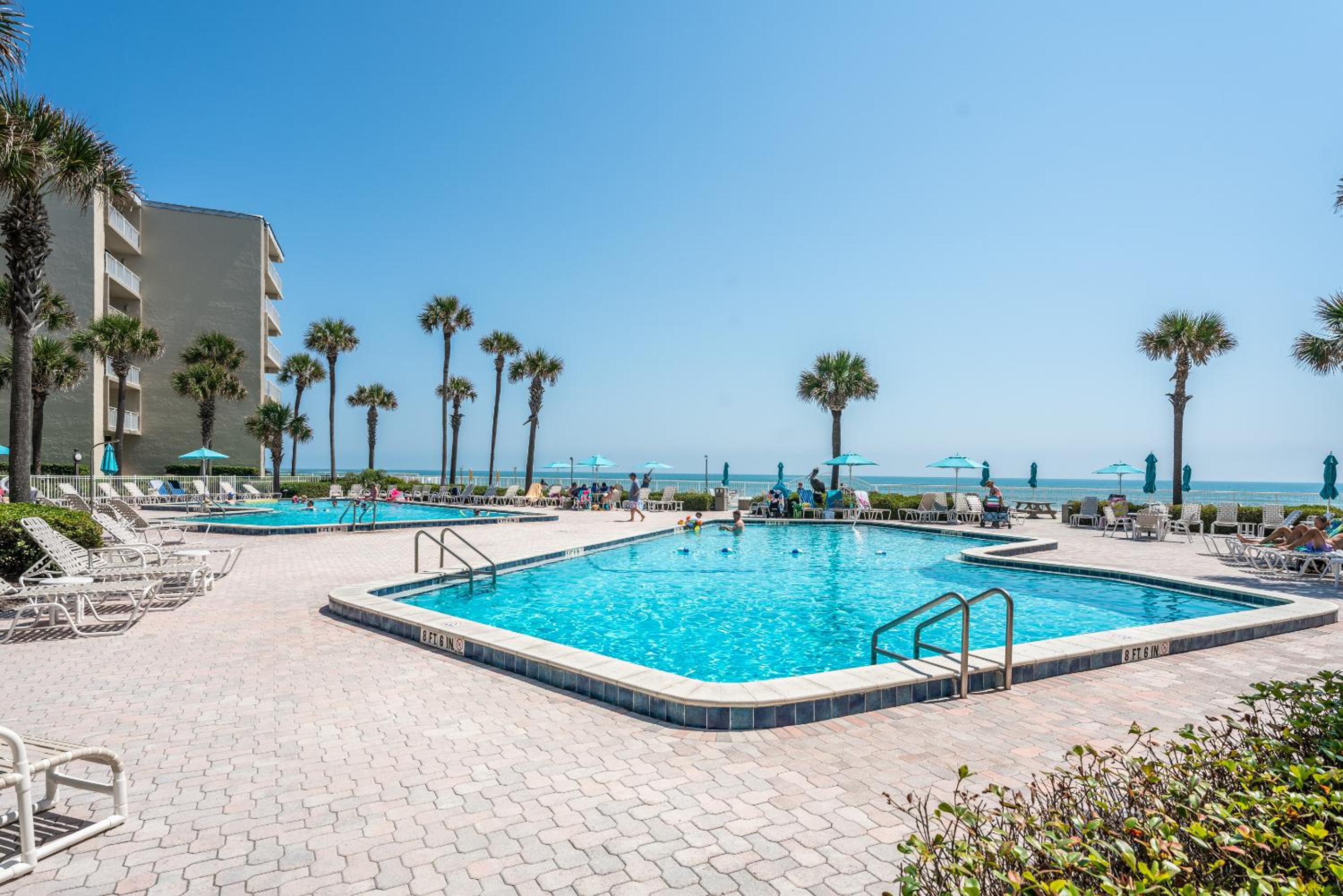 Coastal condo with beachfront views and pool access!