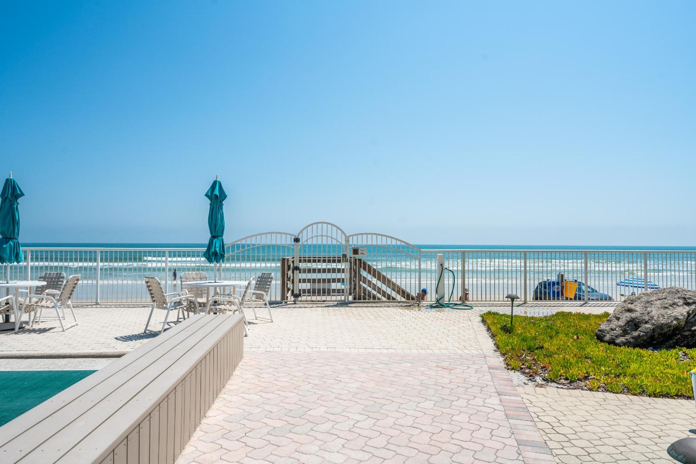 Coastal condo with beachfront views and pool access!