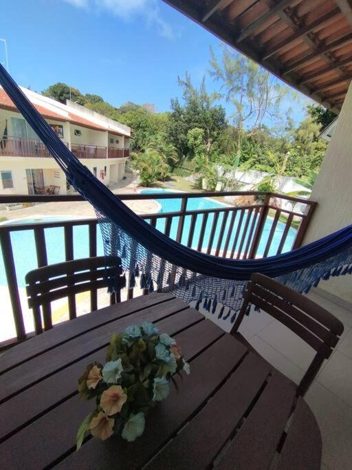 Flat com vista piscina em condomínio SolarAgua