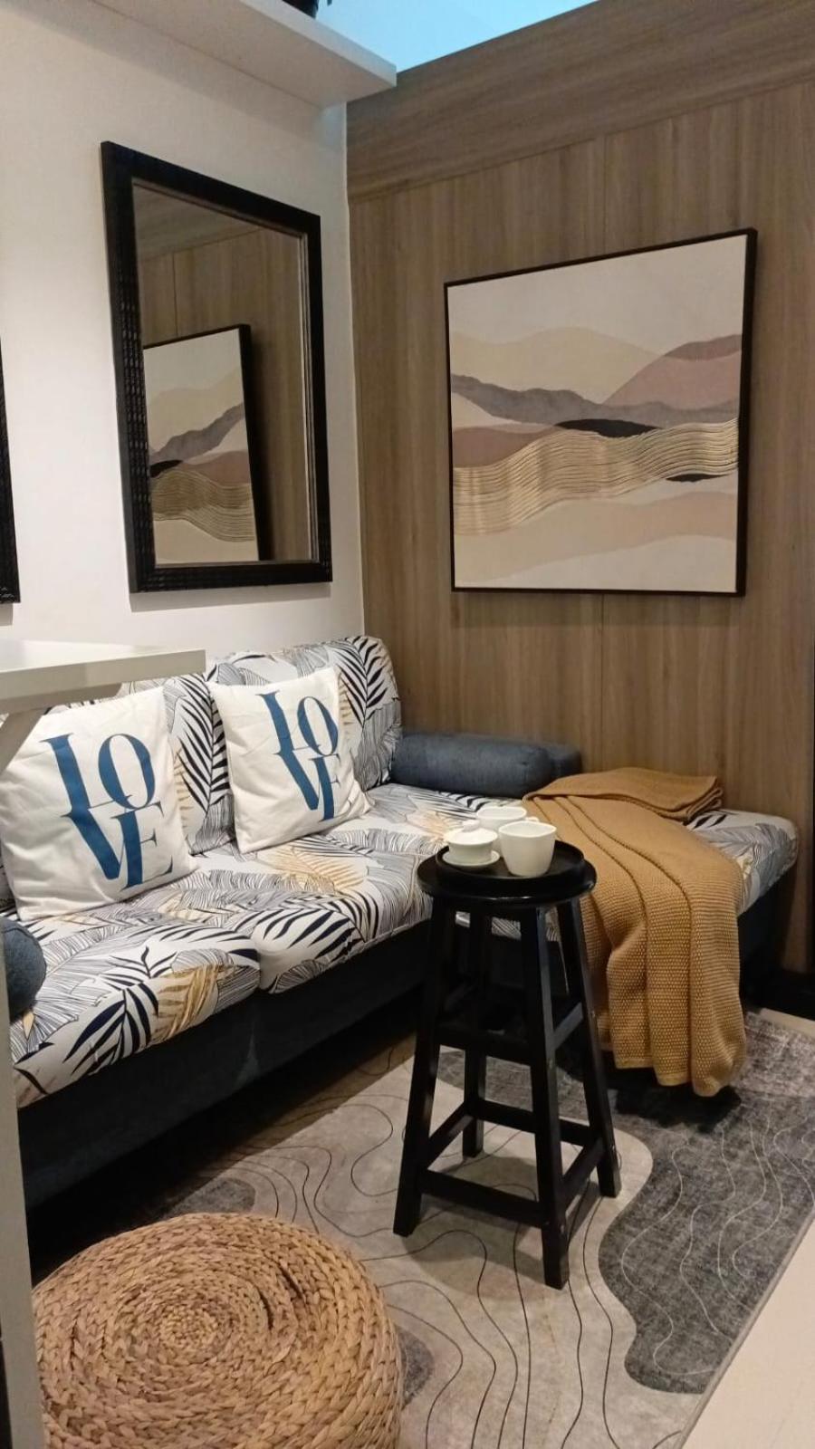 Cozy New 1BR Fame Residences Condo with Balcony view 3