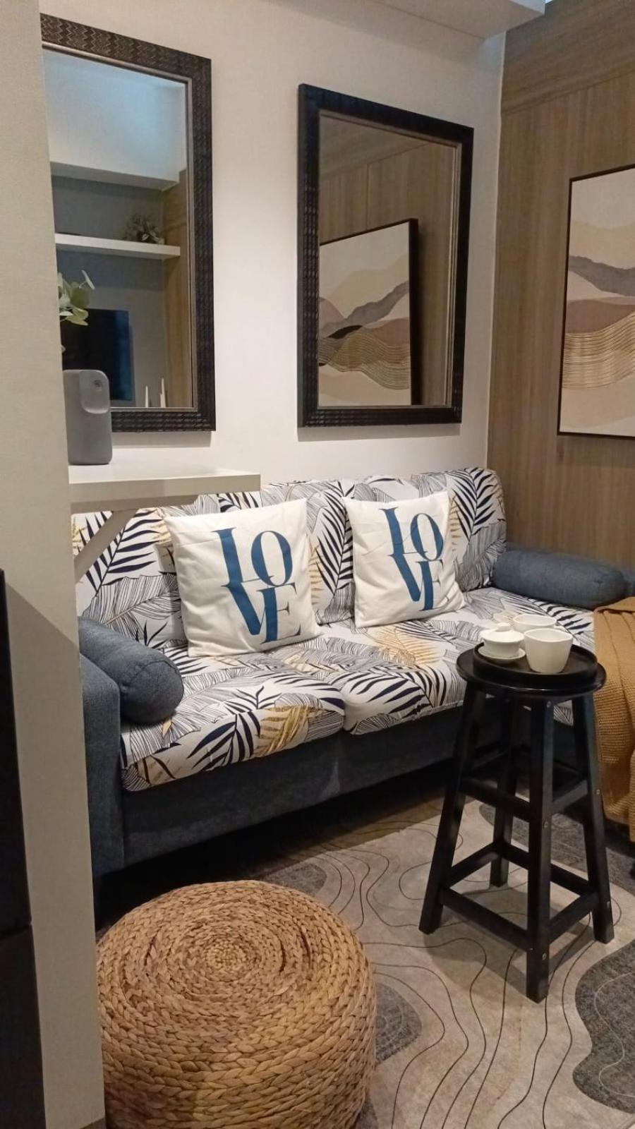 Cozy New 1BR Fame Residences Condo with Balcony view 2