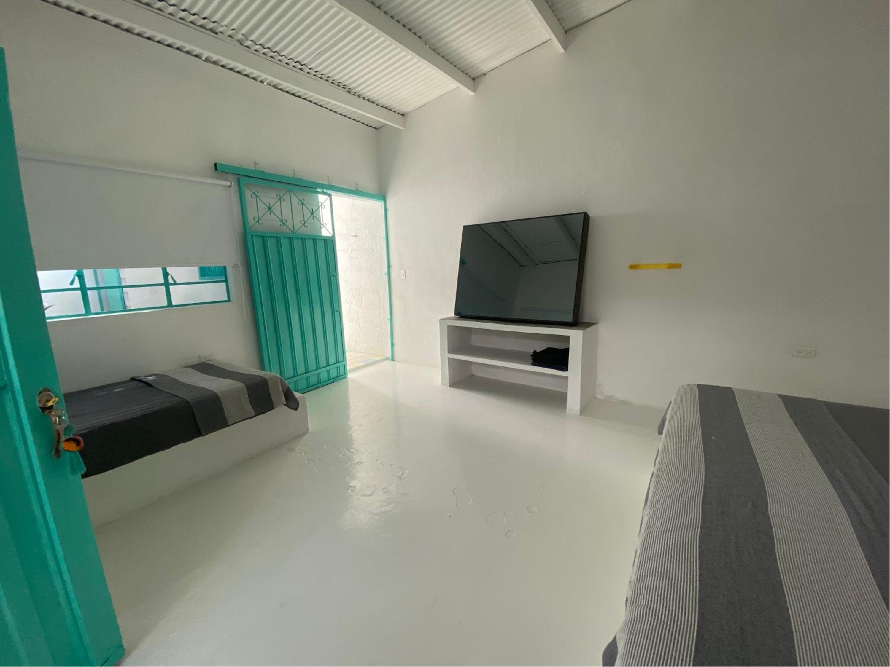 Habitación king 3 personas, casa compartida en Casa Menta