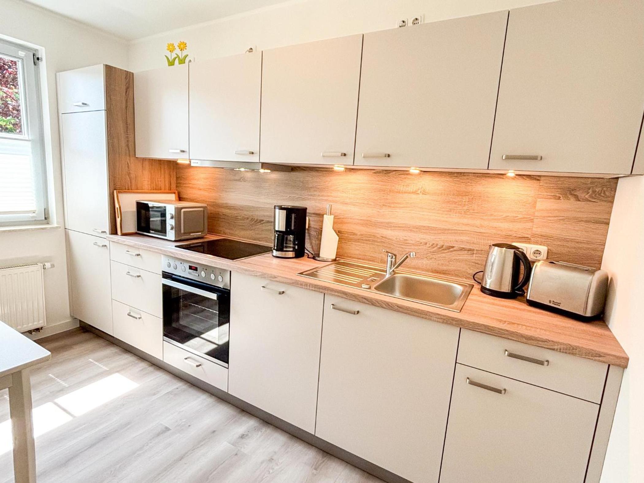 Großzügige Whg. mit verglaster Veranda, geschützter Terrasse
